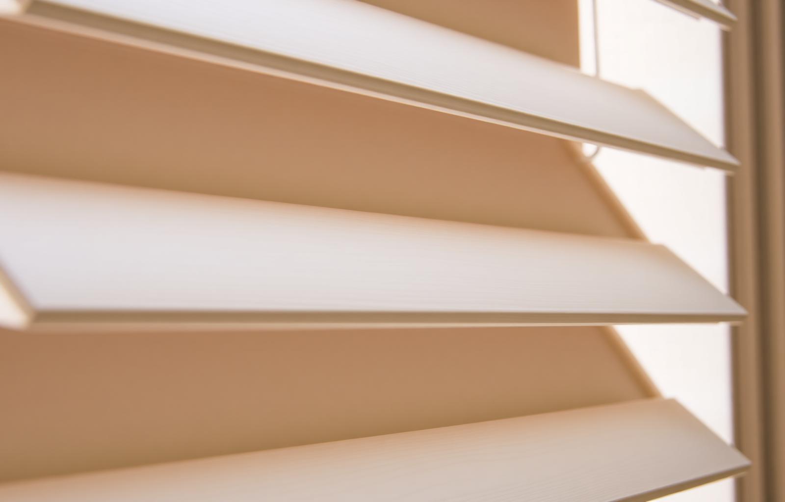 Close-up of premium basswood plantation shutter louvers with painted finish