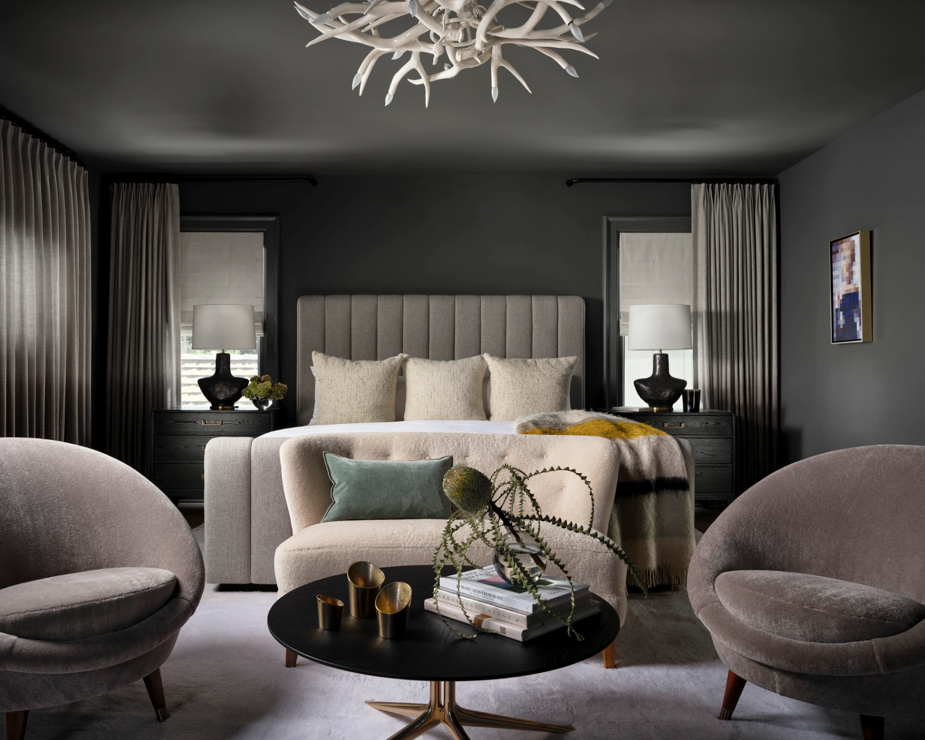 Custom layered drapery with coordinating shades in a dramatic dark moody primary bedroom
