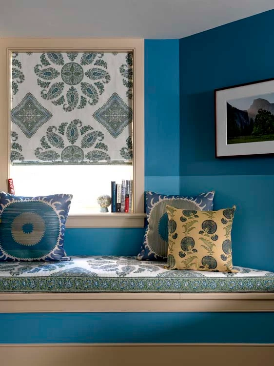 Custom flat Roman shade in a designer blue paisley print with coordinating window seat cushion