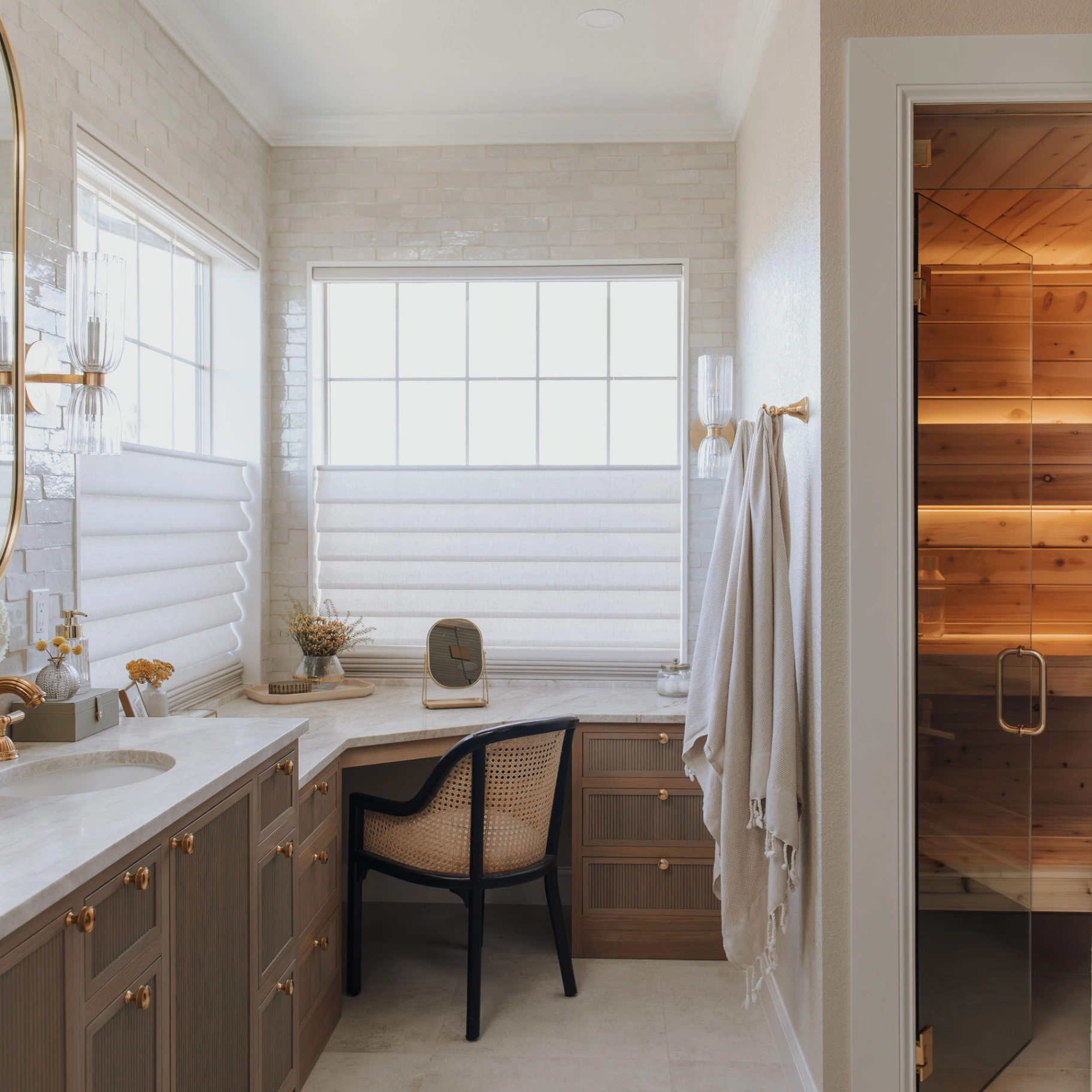 Custom white cellular shade providing soft light diffusion in a spa-inspired primary bathroom
