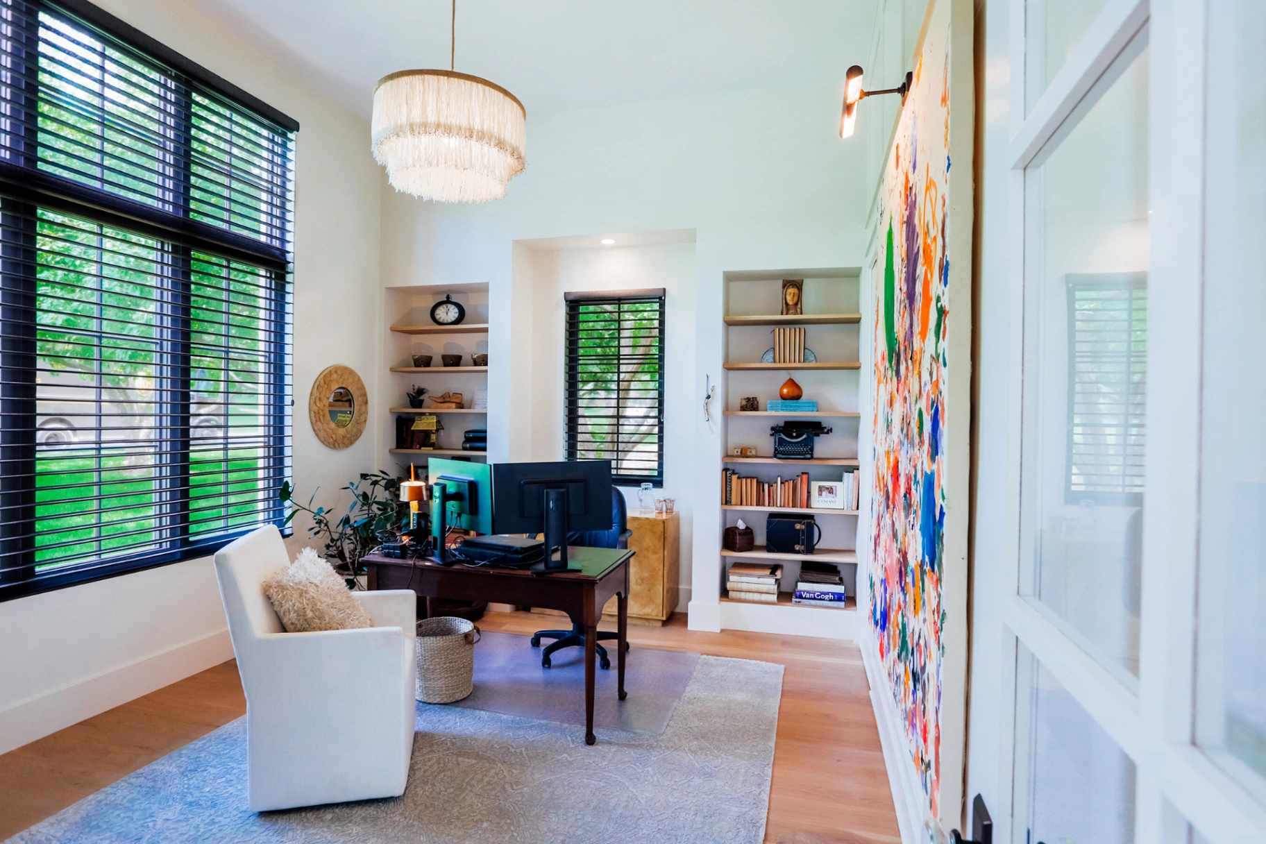 Sleek matte black wood blinds bringing bold contrast to a light-filled eclectic kitchen