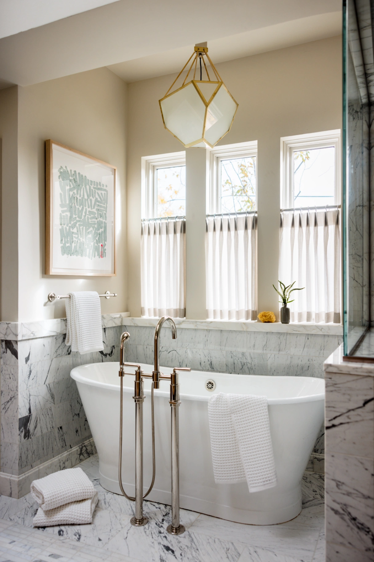 Bespoke half-window café curtain in soft ivory linen — a charming touch in a refined primary bath